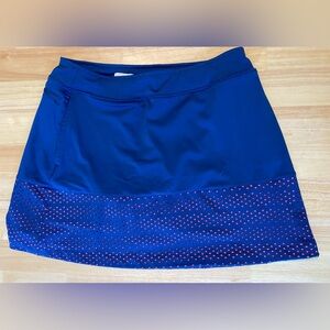 Lady Hagen size M women’s golf skirt. Navy blue with cute neon orange cutout.